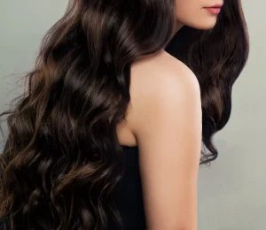 Elegant brunette middle eastern escort with long wavy hair and refined natural beauty.