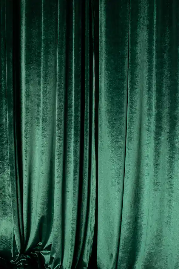 Velvet curtain symbolising discretion and luxury at a London escort agency