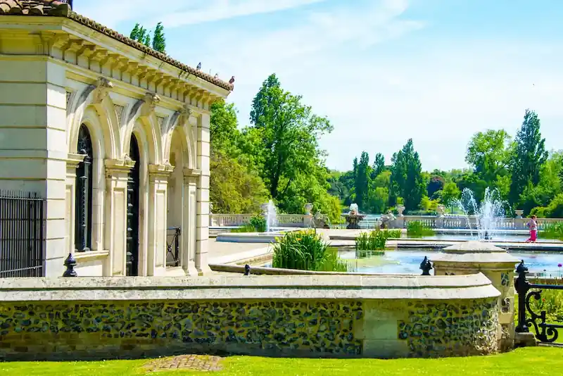 Scenic view of the Serpentine and Italian Gardens in Hyde Park near Park Lane, London, a popular destination for elegant daytime outings.
